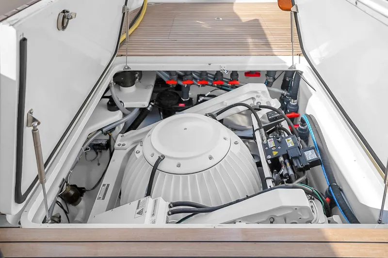Slide: The Image of Engine compartment of a 2012 Viking 76 Convertible yacht, showcasing mechanical components. - 136