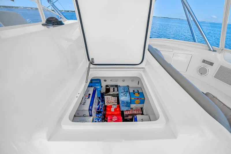 Slide: The Image of Storage compartment on 2012 Viking 76 Convertible yacht, stocked with beverages and supplies. - 38