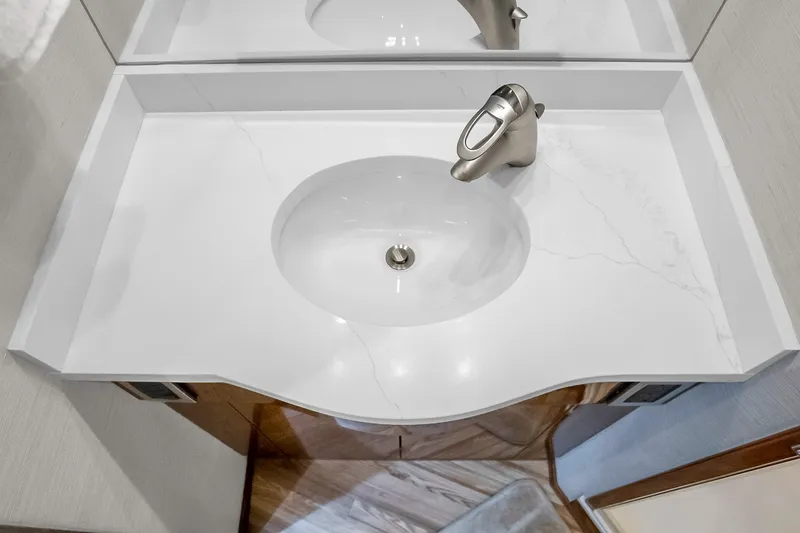 Slide: The Image of Luxurious white bathroom sink in 2012 Viking 76 Convertible yacht. - 111