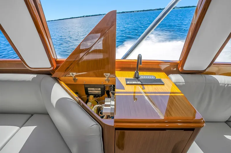 Slide: The Image of Luxurious interior of 2012 Viking 76 Convertible yacht with sleek wood finish and ocean view. - 122