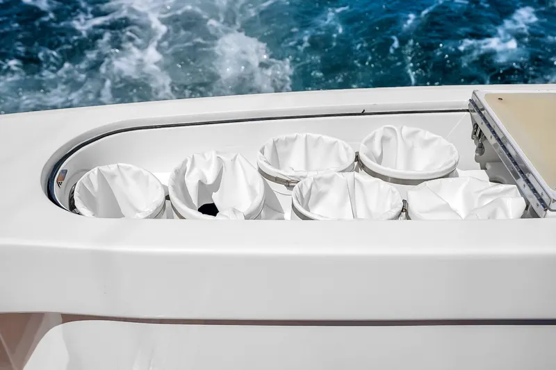 Slide: The Image of Fishing rod holders on a 2012 Viking 76 Convertible yacht with ocean backdrop. - 48