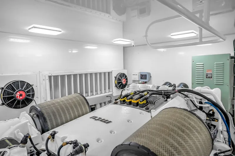 Slide: The Image of Engine room of a 2012 Viking 76 Convertible yacht, featuring MTU engines. - 135