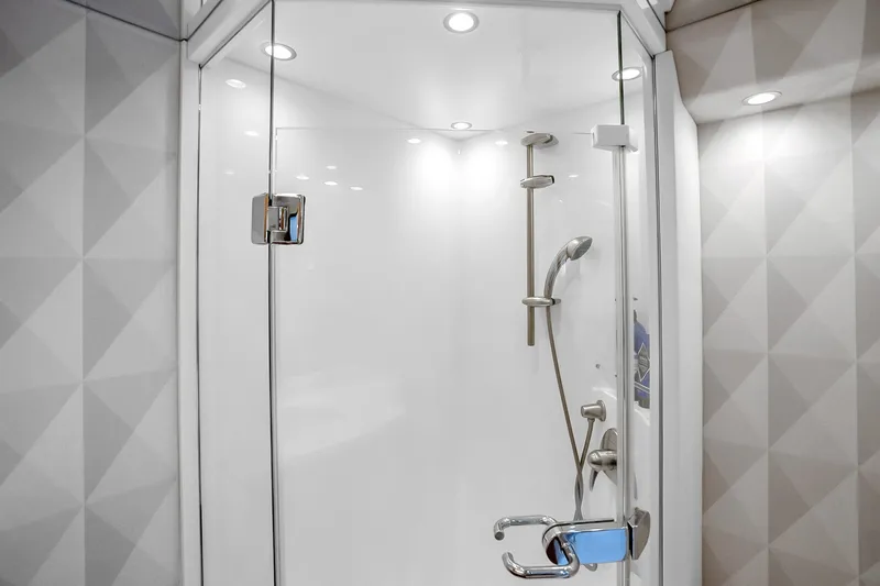 Slide: The Image of Luxurious shower in 2012 Viking 76 Convertible yacht, featuring modern fixtures and sleek design. - 90