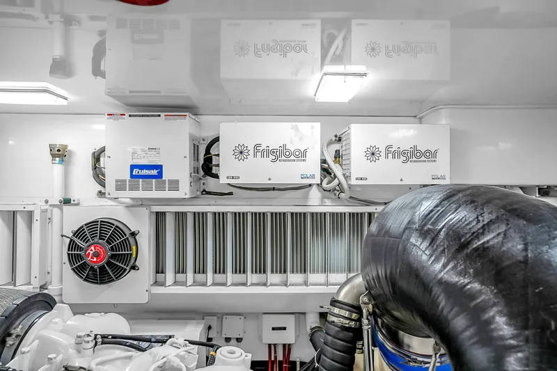 Slide: The Image of Engine room of 2012 Viking 76 Convertible with refrigeration systems and ventilation. - 133