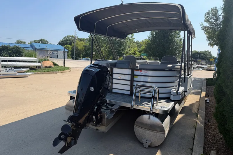 Slide: The Image of 2022 Crest Classic DLX 220 SLC pontoon boat with canopy and outboard motor. - 4