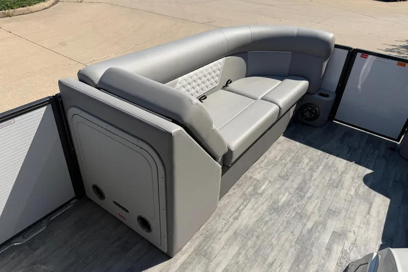 Slide: The Image of 2022 Crest Classic DLX 220 SLC pontoon boat with gray seating and flooring. - 10