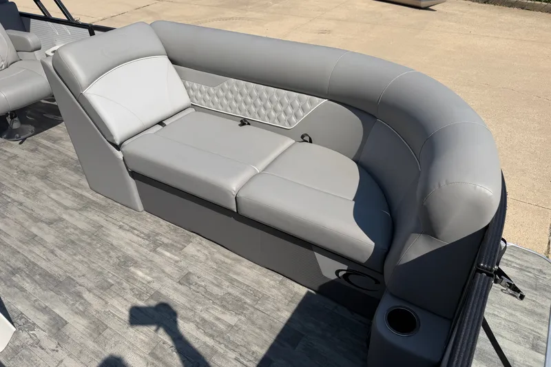 Slide: The Image of 2022 Crest Classic DLX 220 SLC pontoon boat with luxurious gray seating. - 6