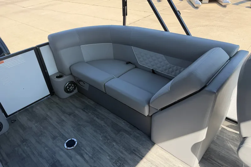 Slide: The Image of Luxurious seating on 2022 Crest Classic DLX 220 SLC pontoon boat, featuring gray upholstery. - 13