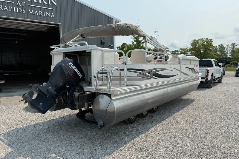 Slide: The Image of 2008 Manitou Oasis pontoon boat with Evinrude motor at marina. - 3