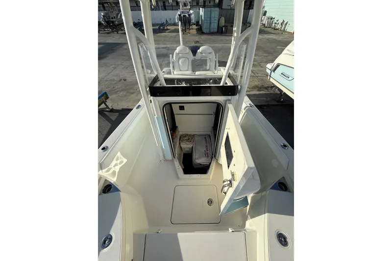 Slide: The Image of 2017 Ranger 2510 Bay Ranger boat interior with open storage compartment. - 8