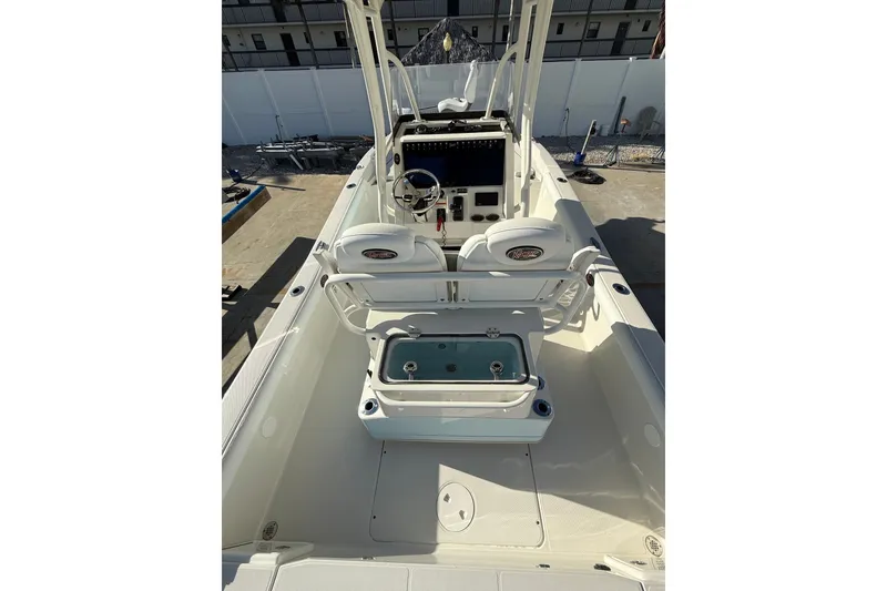 Slide: The Image of 2017 Ranger 2510 Bay Ranger boat interior with helm and seating area. - 10