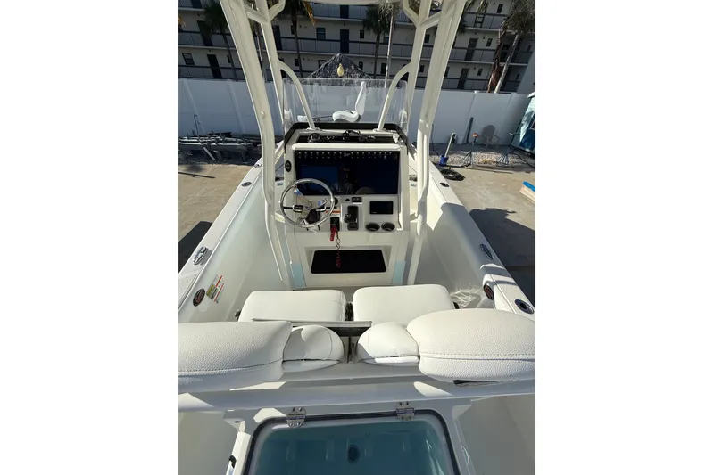Slide: The Image of 2017 Ranger 2510 Bay Ranger boat interior with steering console and seating. - 3