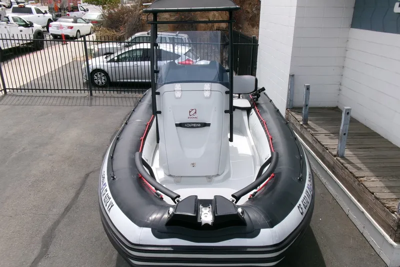 Slide: The Image of 2023 Zodiac Open 5.5 inflatable boat parked outdoors, showcasing sleek design and modern features. - 20