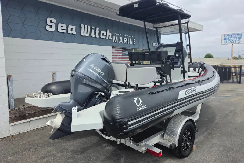 Slide: The Image of 2023 Zodiac Open 5.5 boat with Yamaha engine at Sea Witch Marine dealership. - 2
