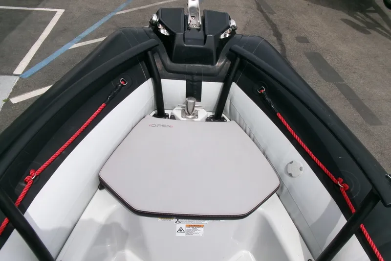 Slide: The Image of 2023 Zodiac Open 5.5 boat interior with seating and red ropes. - 4