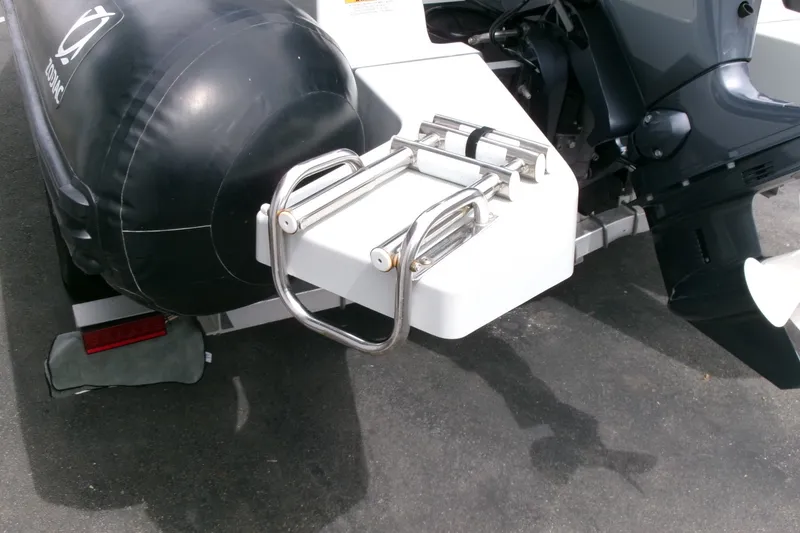 Slide: The Image of 2023 Zodiac Open 5.5 boat with stainless steel ladder and outboard motor. - 18