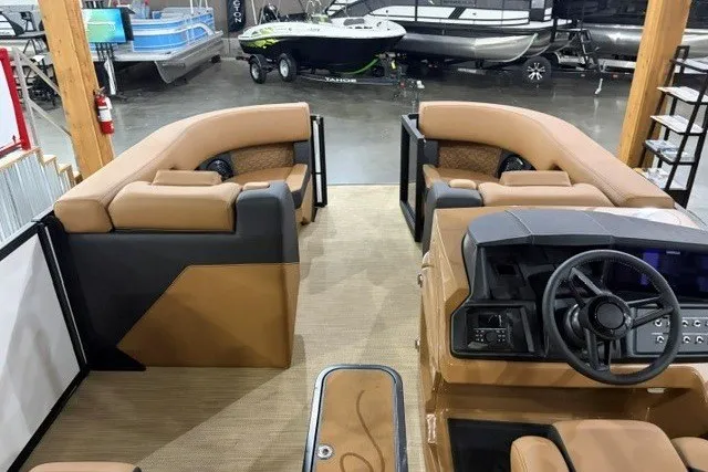 Slide: The Image of Interior of 2027 Alera M23L boat with tan seating and modern dashboard. - 10