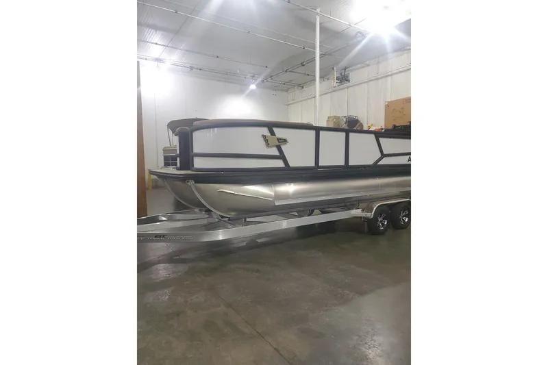 Slide: The Image of 2027 Alera M23L pontoon boat on trailer in indoor storage facility. - 4
