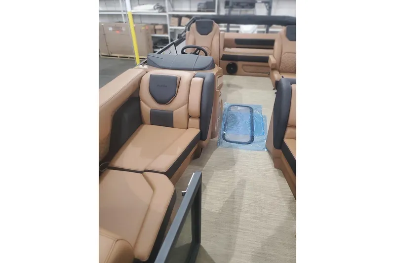 Slide: The Image of Luxurious interior of 2027 Alera M23L boat with tan leather seating. - 5