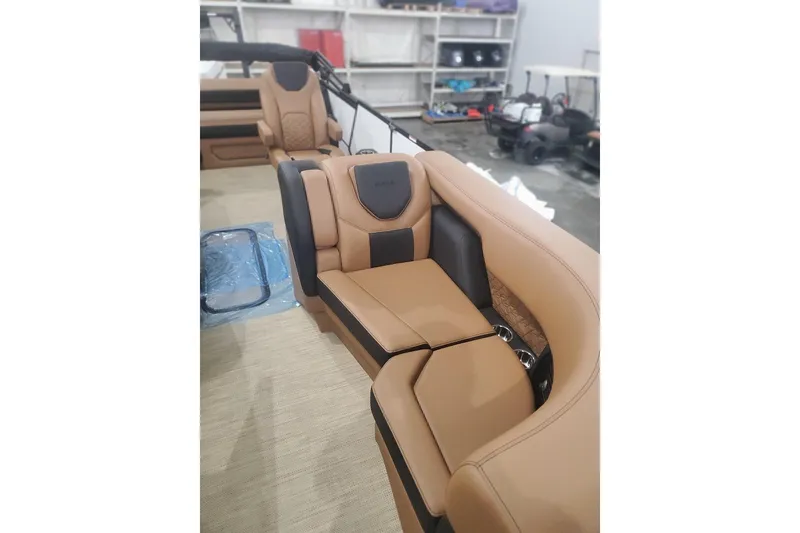 Slide: The Image of Luxurious tan and black seating in 2027 Alera M23L boat interior. - 6