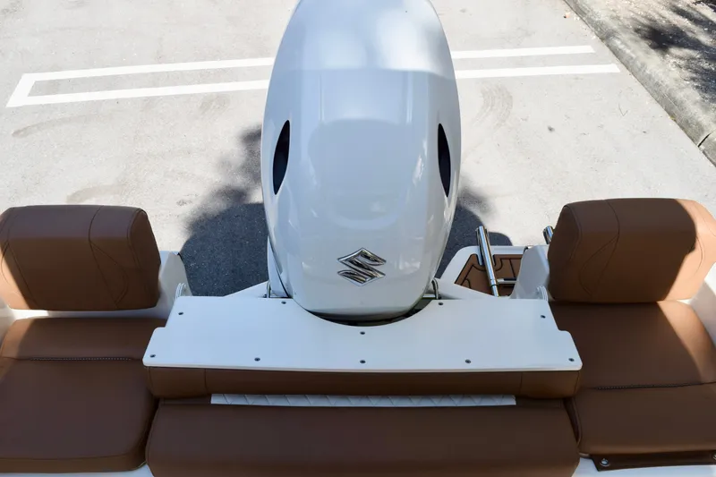 Slide: The Image of 2025 Pioneer 180 Islander boat with brown seating and Suzuki outboard motor. - 5