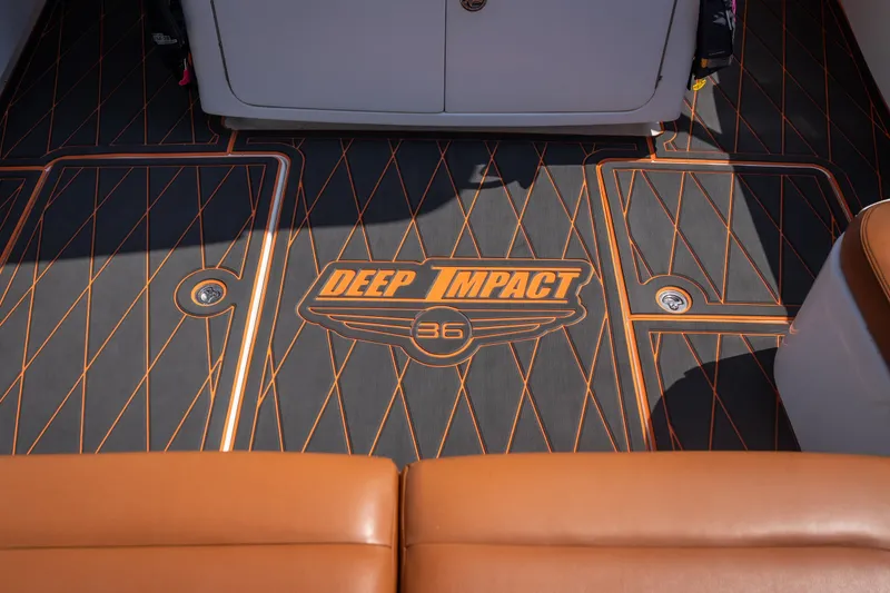 Slide: The Image of Deck of 2007 Deep Impact 360 C boat with logo and orange accents. - 21