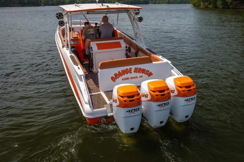 Slide: The Image of 2007 Deep Impact 360 C boat with triple 400R engines on a lake. - 57