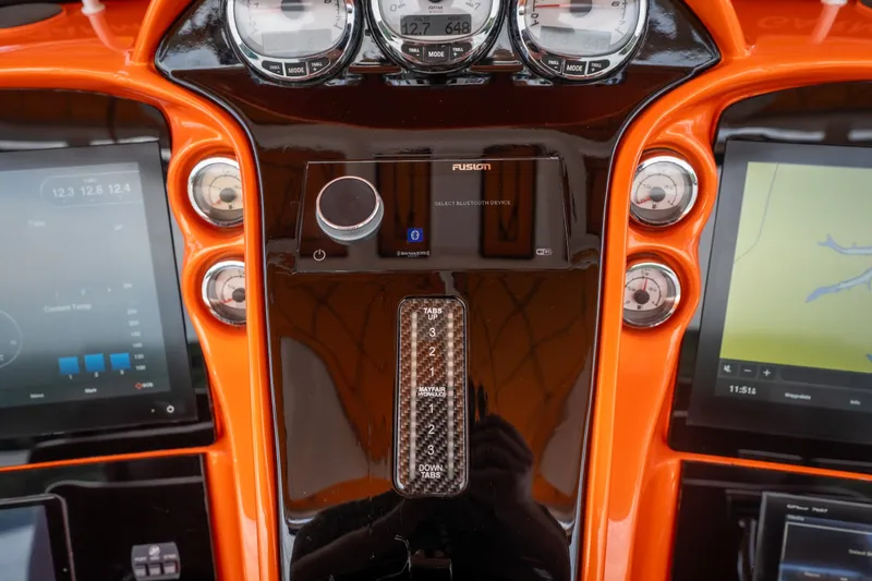 Slide: The Image of Dashboard of a 2007 Deep Impact 360 C boat with modern navigation controls. - 14