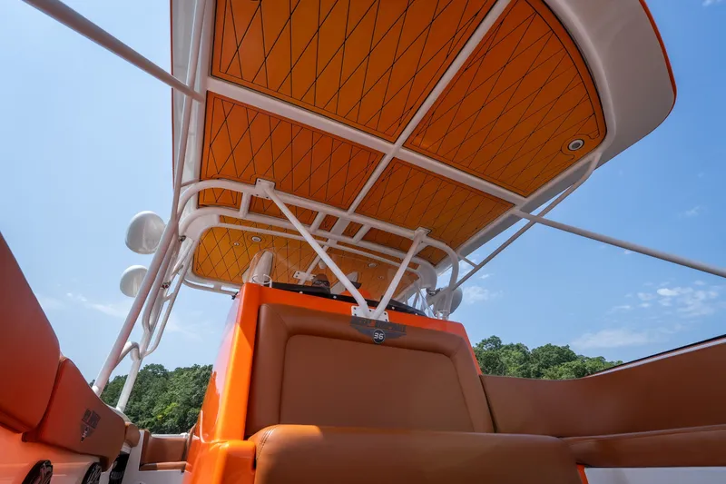 Slide: The Image of Orange interior of 2007 Deep Impact 360 C boat under clear blue sky. - 45