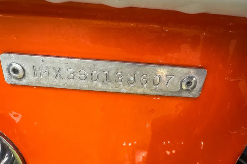 Slide: The Image of Close-up of a 2007 Deep Impact 360 C hull identification number plate. - 50