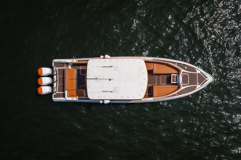 Slide: The Image of Aerial view of 2007 Deep Impact 360 C boat with triple engines on water. - 5