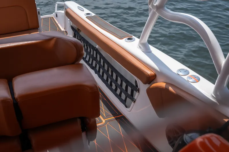 Slide: The Image of Luxurious seating on a 2007 Deep Impact 360 C boat with brown leather and ocean view. - 35