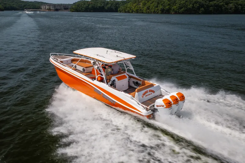 Slide: The Image of Orange Deep Impact 360 C boat speeding on a lake, 2007 model. - 1