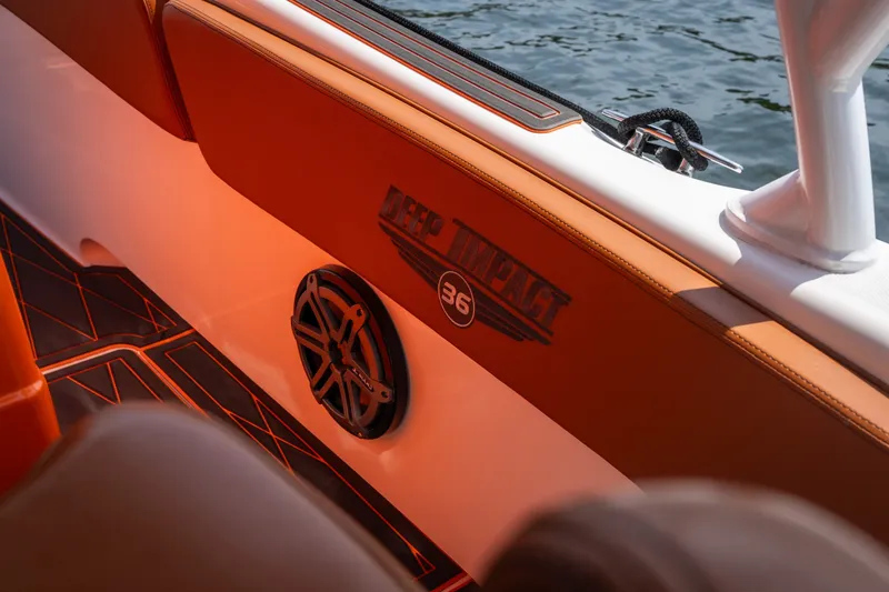 Slide: The Image of Interior of 2007 Deep Impact 360 C boat with logo and speaker detail. - 44