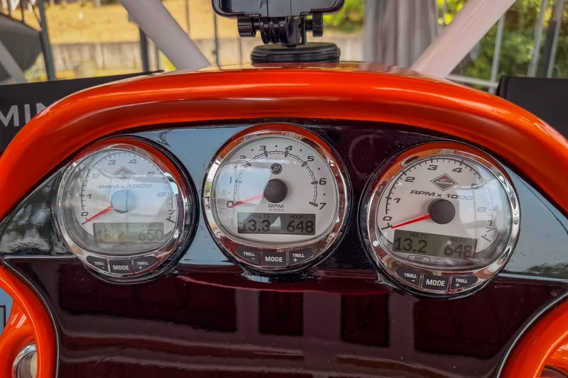 Slide: The Image of Dashboard of a 2007 Deep Impact 360 C boat with RPM gauges. - 49