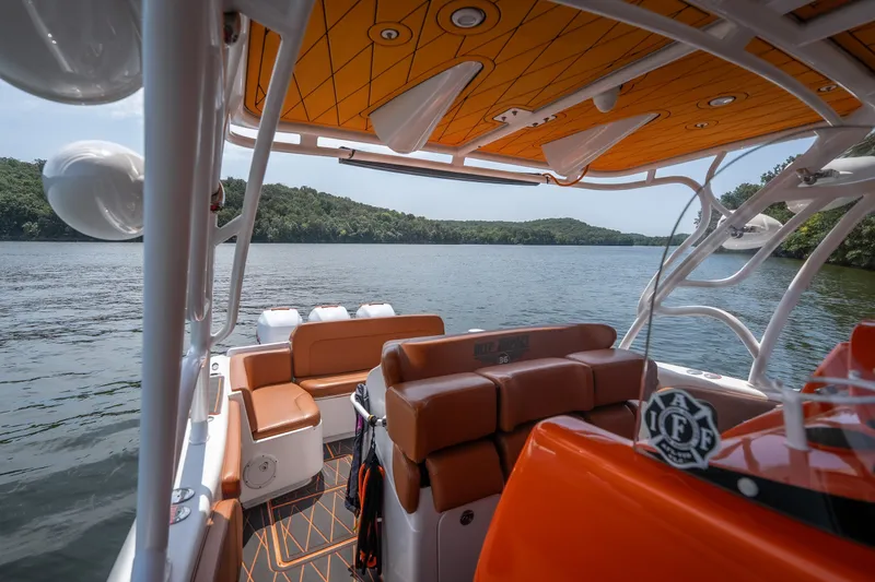 Slide: The Image of Interior view of 2007 Deep Impact 360 C boat on a scenic lake. - 37