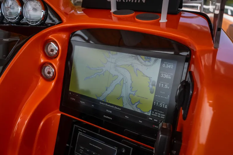 Slide: The Image of Orange dashboard of 2007 Deep Impact 360 C with Garmin GPS display. - 13