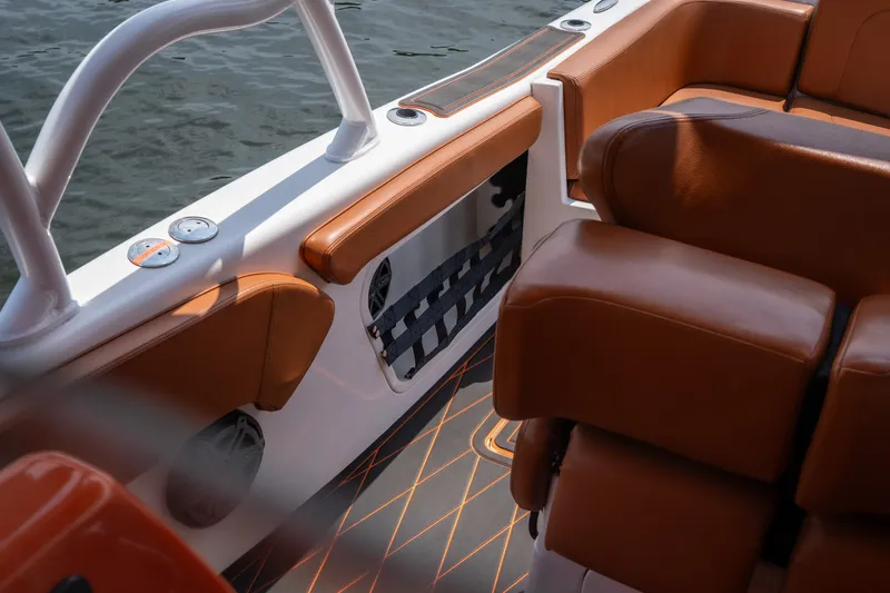 Slide: The Image of Luxurious interior of a 2007 Deep Impact 360 C boat with brown leather seating. - 36