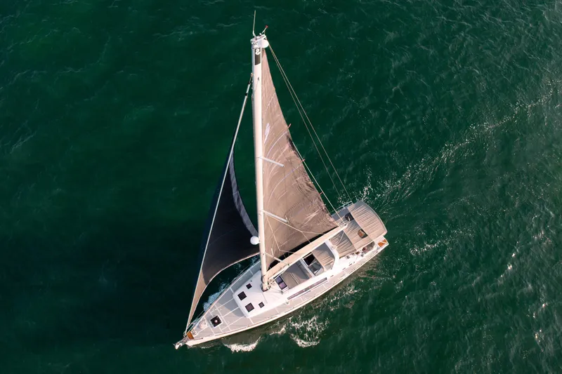 Slide: The Image of Aerial view of 2013 Beneteau Oceanis 48 sailing on open water. - 15