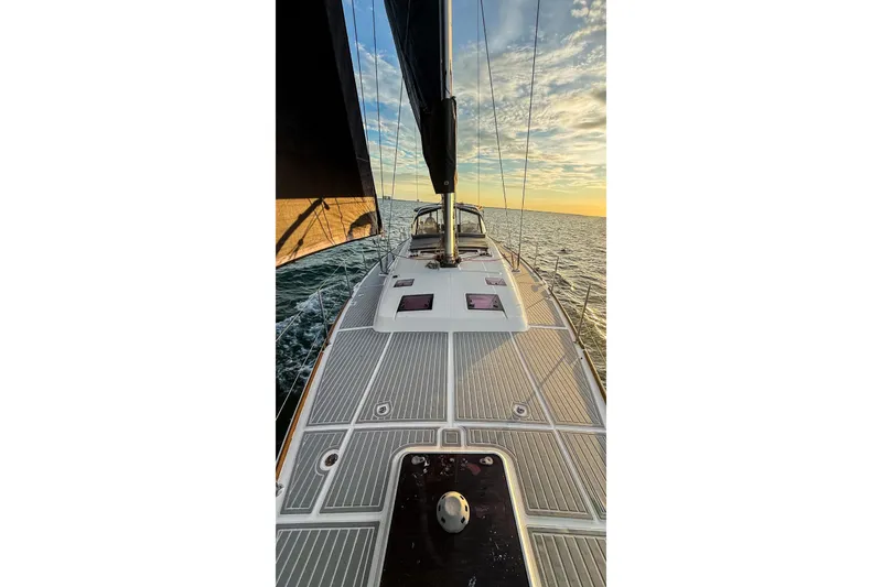 Slide: The Image of Sailing on a 2013 Beneteau Oceanis 48 yacht at sunset, open sea view. - 14