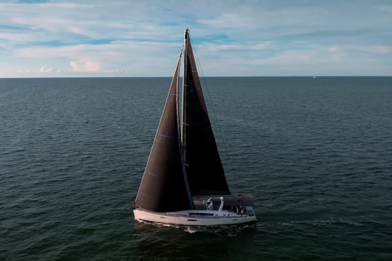 Slide: The Image of Sailing yacht Beneteau Oceanis 48, 2013 model, cruising on open sea under clear skies. - 17