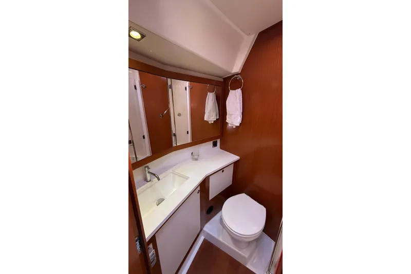 Slide: The Image of Bathroom interior of 2013 Beneteau Oceanis 48 yacht, featuring sink and toilet. - 8