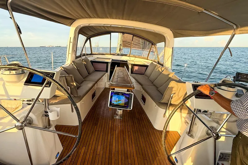 Slide: The Image of Luxurious 2013 Beneteau Oceanis 48 yacht interior with dual steering wheels and ocean view. - 12