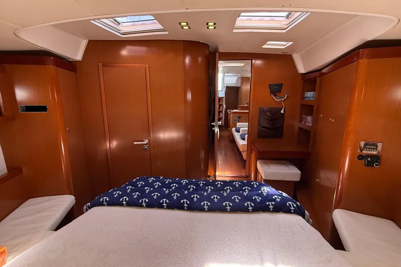 Slide: The Image of Luxurious interior of 2013 Beneteau Oceanis 48 yacht with wood finish and skylights. - 9