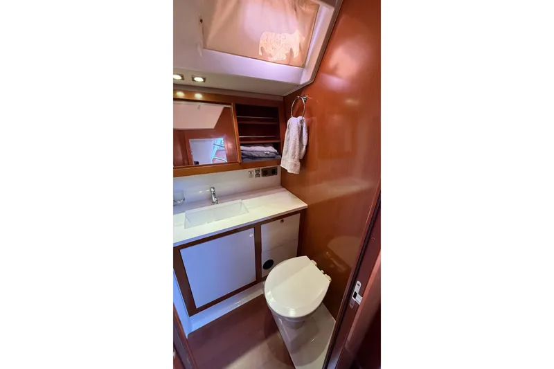 Slide: The Image of Bathroom interior of 2013 Beneteau Oceanis 48 yacht, featuring sink and toilet. - 3