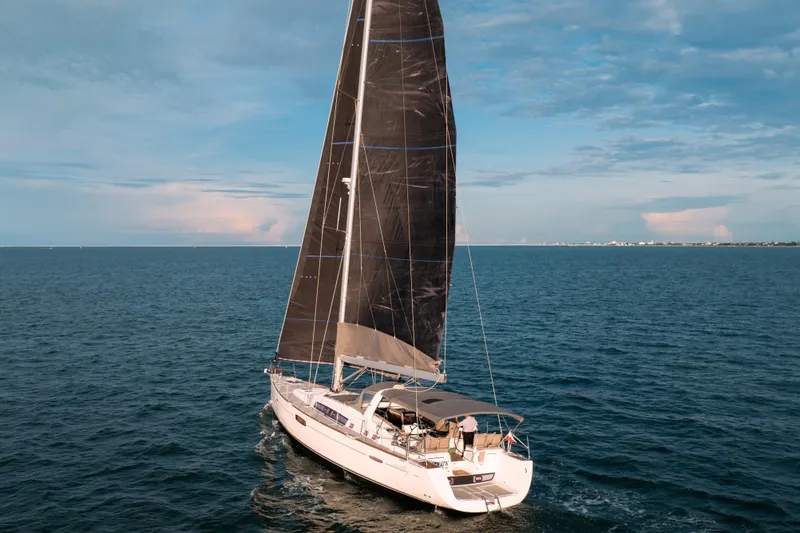 Slide: The Image of Sailing yacht Beneteau Oceanis 48, 2013 model, cruising on open sea under clear skies. - 16