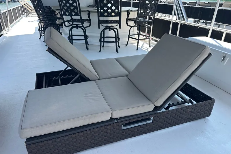 Slide: The Image of Sun deck with adjustable loungers on a 2006 Starlite 16x84 houseboat. - 21