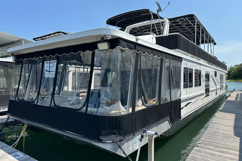 The Image of Houseboat for sale, 2006 Starlite 16x84, docked on a sunny day. - 0