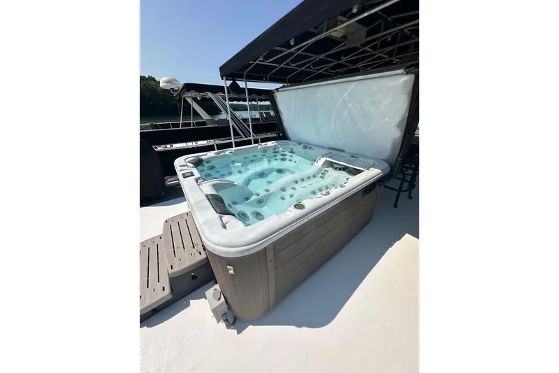 Slide: The Image of Hot tub on 2006 Starlite 16x84 houseboat deck under canopy. - 20