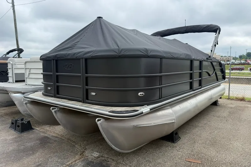The Image of 2026 Bentley Pontoons Legacy 223 Swingback with black cover, parked on pavement. - 0